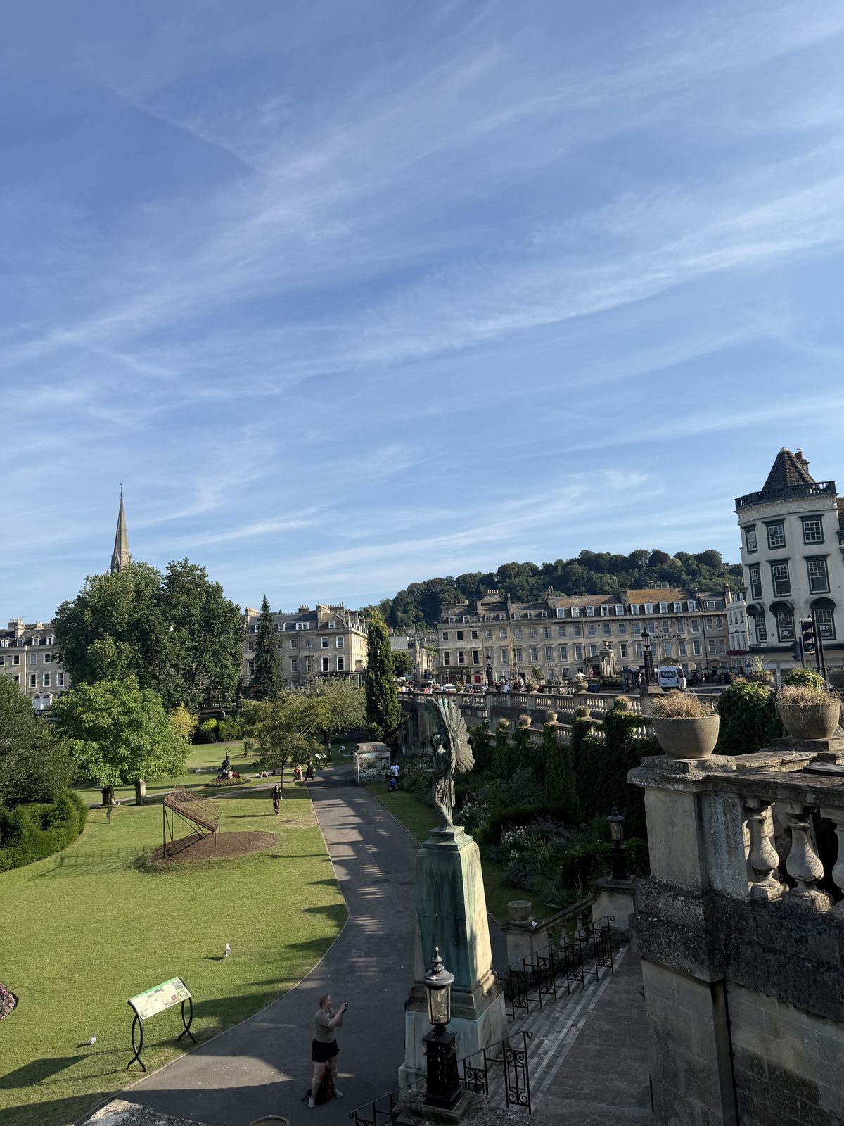 View across the flowerbeds of Parade Gardens toward the rooftops of Bath's historic centre