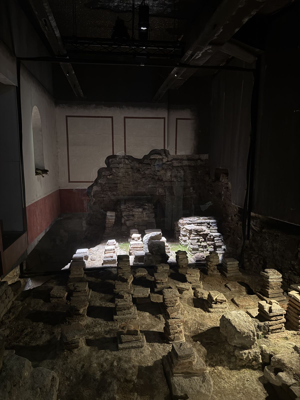 The East Baths chambers at the Roman Baths with worn stone floors and pillars