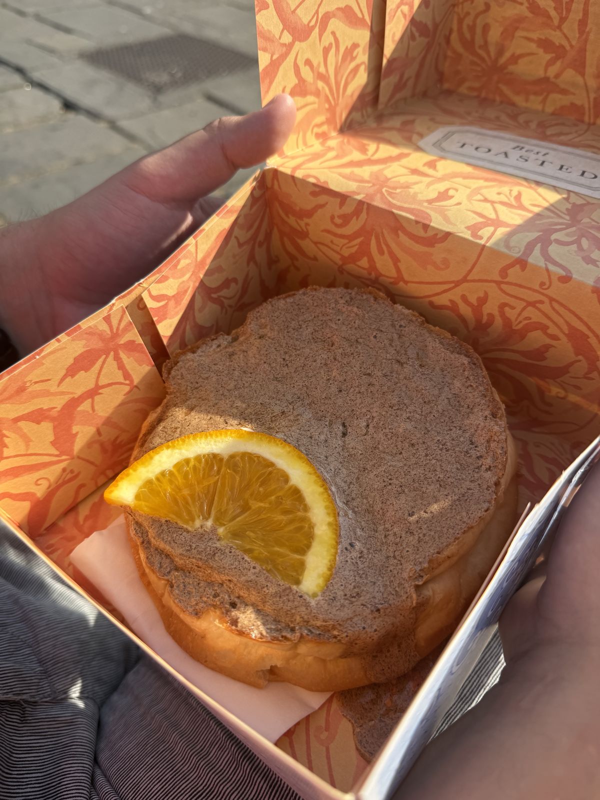 A toasted Sally Lunn bun served split and buttered at Sally Lunn's in Bath